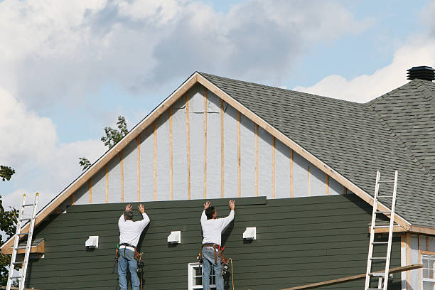 Professional Storm Damage Siding Repair technician working in Brighton, MA